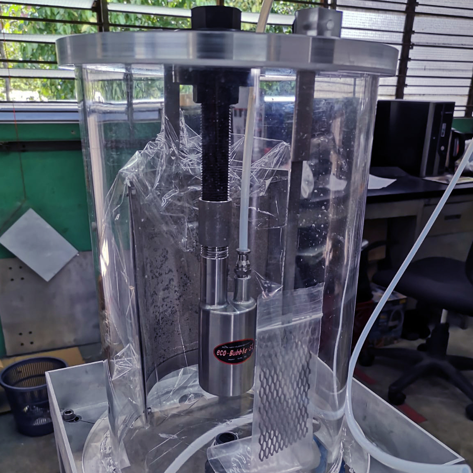 Cylindrical acrylic tank with steel components and pipes Cylindrical acrylic tank with steel components and pipes