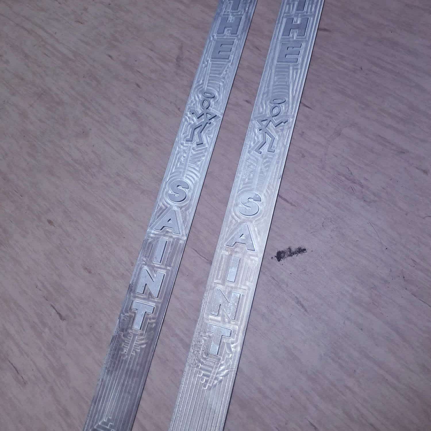 Two patterned aluminum car door sills Two patterned aluminum car door sills