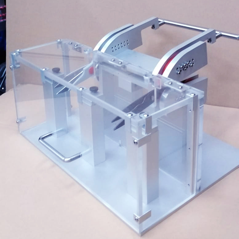 Device holding two pairs of scissors in an acrylic box Device holding two pairs of scissors in an acrylic box